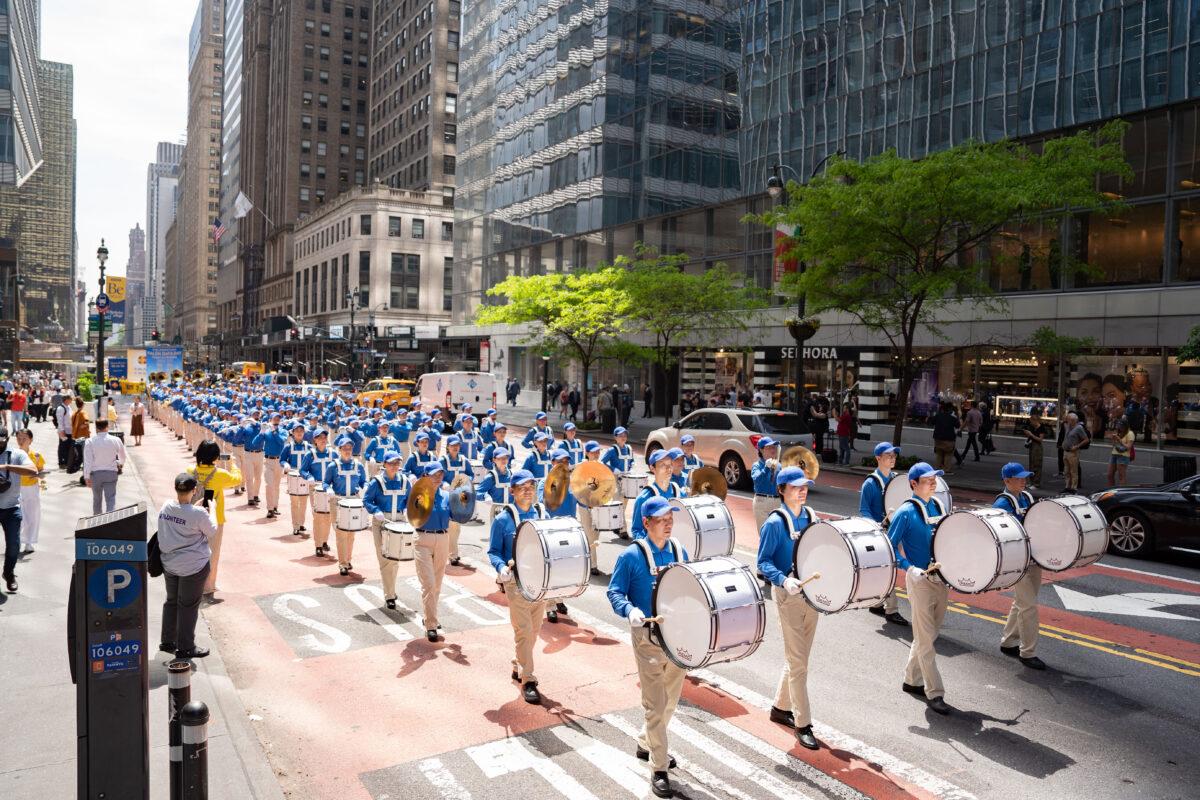 Falun Gong practitioners march in Manhattan to celebrate World Falun Dafa Day on May 12, 2023. (Samira Bouaou/The Epoch Times)