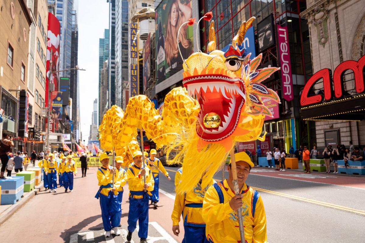 Falun Gong practitioners march in Manhattan to celebrate World Falun Dafa Day on May 12, 2023. (Samira Bouaou/The Epoch Times)
