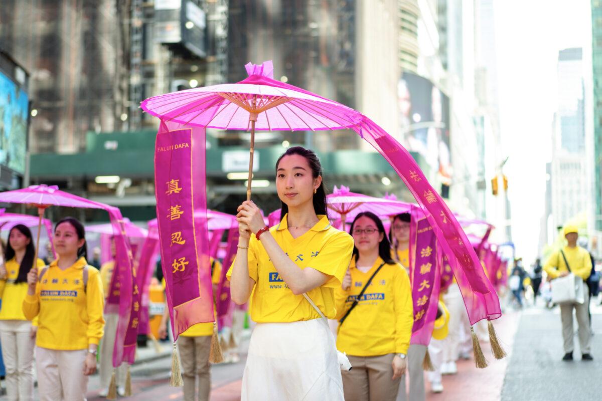 Falun Gong practitioners march in Manhattan to celebrate World Falun Dafa Day on May 12, 2023. (Samira Bouaou/The Epoch Times)