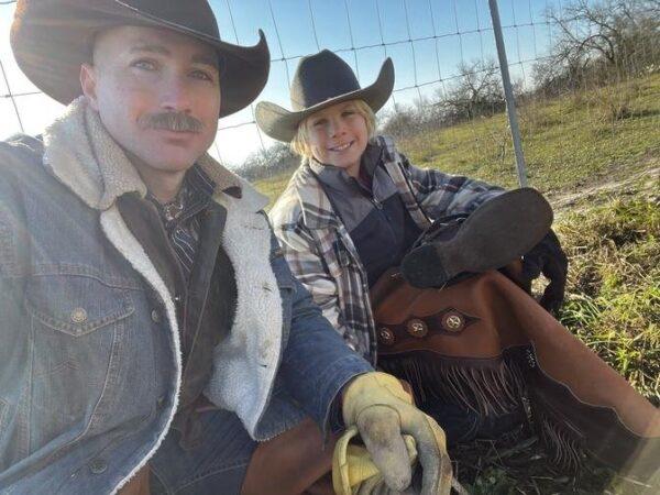 A father and son are taking a break along their 8-day trail ride with their horses. (Courtesy of Gan Jing World)