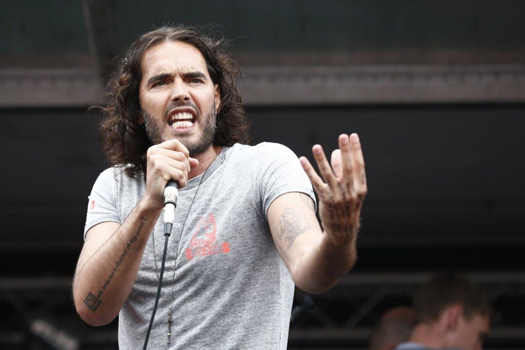 Russell Brand Gets Baptized in the River Thames