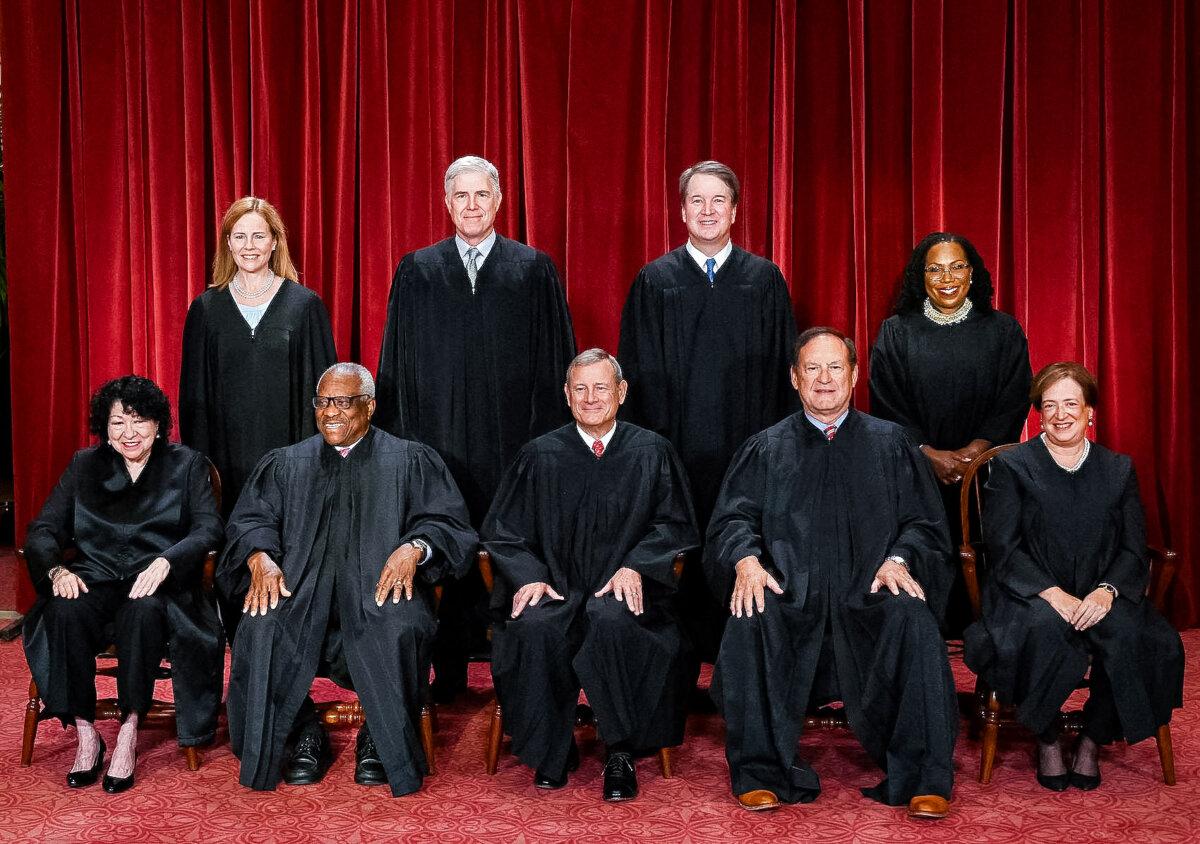 Justices of the U.S. Supreme Court pose for their official photo at the Supreme Court in Washington on Oct. 7, 2022. (Front L–R) Justices Sonia Sotomayor and Clarence Thomas, Chief Justice John Roberts, Justice Samuel Alito and Justice Elena Kagan. (Back L–R) Justices Amy Coney Barrett, Neil Gorsuch, Brett Kavanaugh, and Ketanji Brown Jackson. (Olivier Douliery/AFP via Getty Images)
