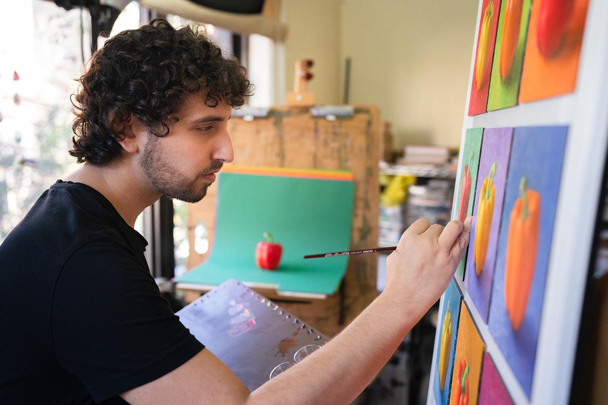 Mr. Goshen painting "Pilpelim" in his studio, photographed by Jeremy Cohen. (Courtesy of Ken Goshen)