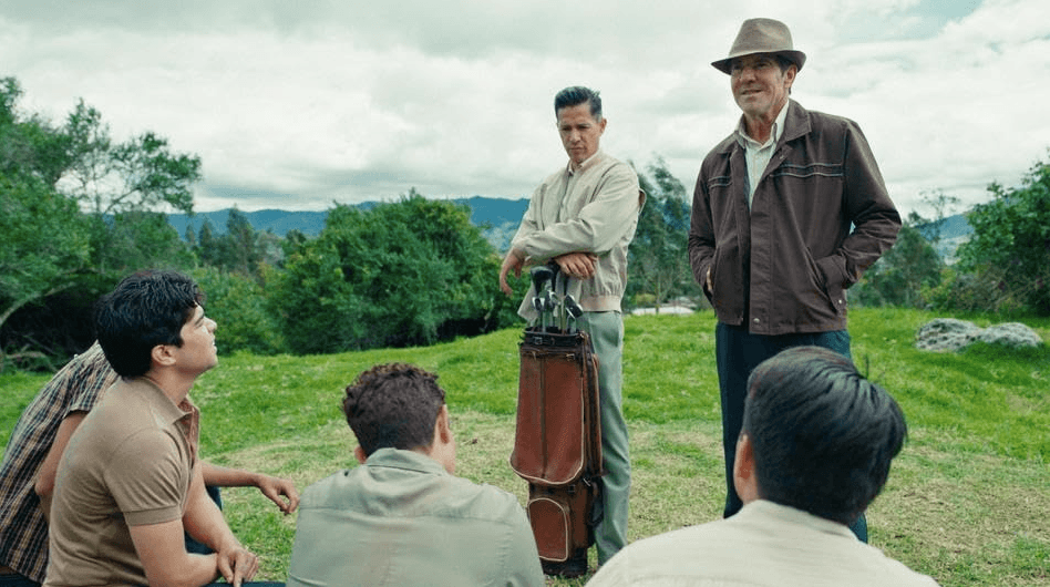 JB Peña (Jay Hernandez) and Frank Mitchell (Dennis Quaid) talk with the boys about what it will take to win a golf championship, in "The Long Game." (Bonniedale/Mucho Mas Releasing)
