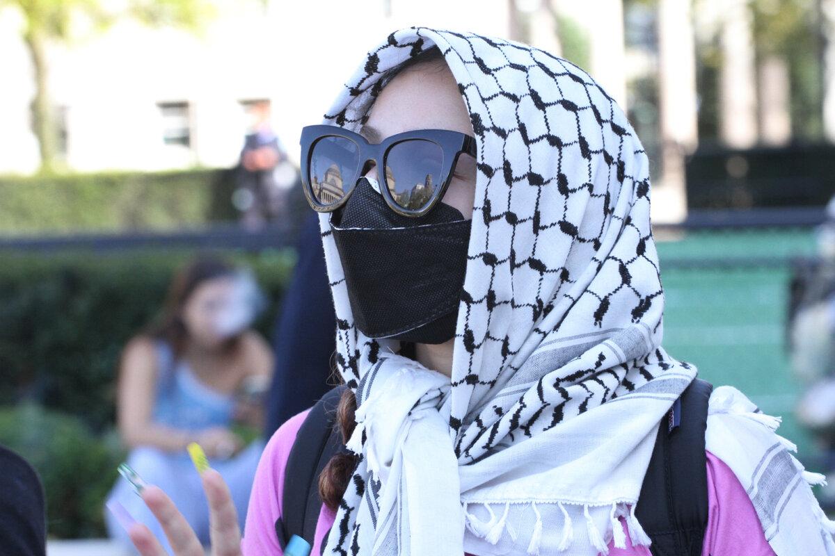 A pro-Palestinian protester in the encampment on the Columbia University campus in New York City on April 23, 2024. (Richard Moore/The Epoch Times)