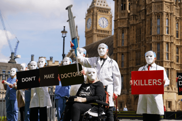 Campaigners protest against assisted suicide outside Parliament ahead of a debate in the House of Commons in Westminster, London, on April 29, 2024. (Jordan Pettitt/PA Wire)