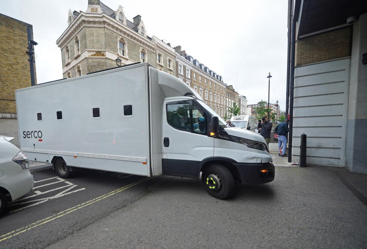 A custody van containing three men accusing of aiding Hong Kong intelligence services arrives at Westminster Magistrates' Court in central London, on May 13, 2024. (Yui Mok/PA)